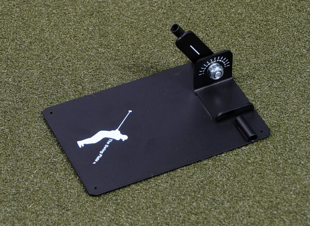 The Swing Plate Base training aid lying flat on a synthetic turf surface